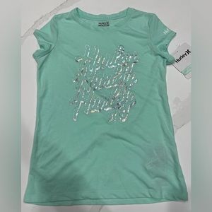 Hurley kids teal soft short sleeve t-shirt with holographic lettering. LG 12/13